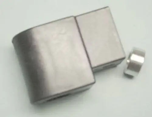 Spule in silberner Farbe, kombiniert mit einer runden, kleinen Magnetkomponente. Produkt von Remeha, möglicherweise für ein Magnetventil oder ähnliches Gerät.